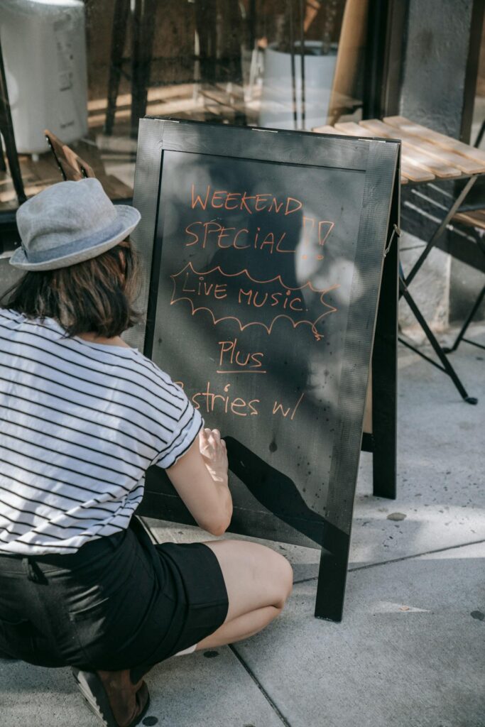 handwritten menu, old-style typewritten specials, chef writing on chalkboard.