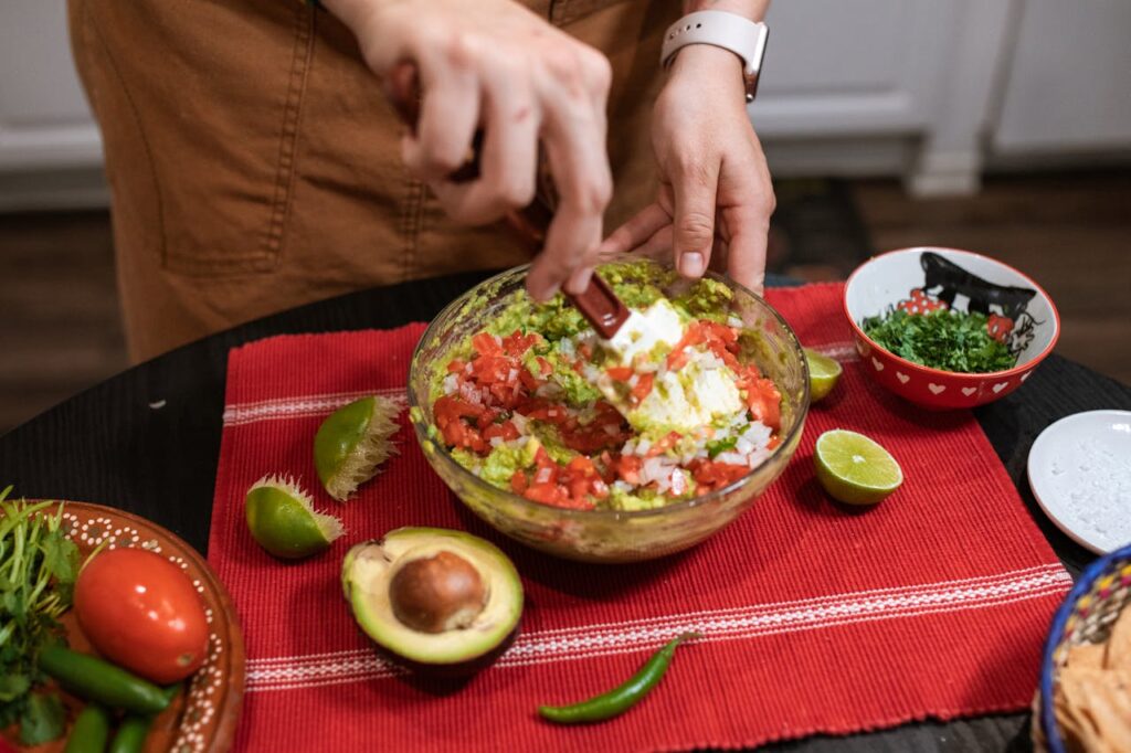 Avocado chunks mixed with peppers, tomatoes, and onion in a guacamole-style salad.