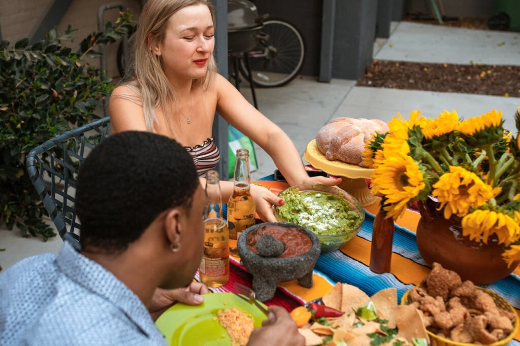 people eating food with dip tables visible