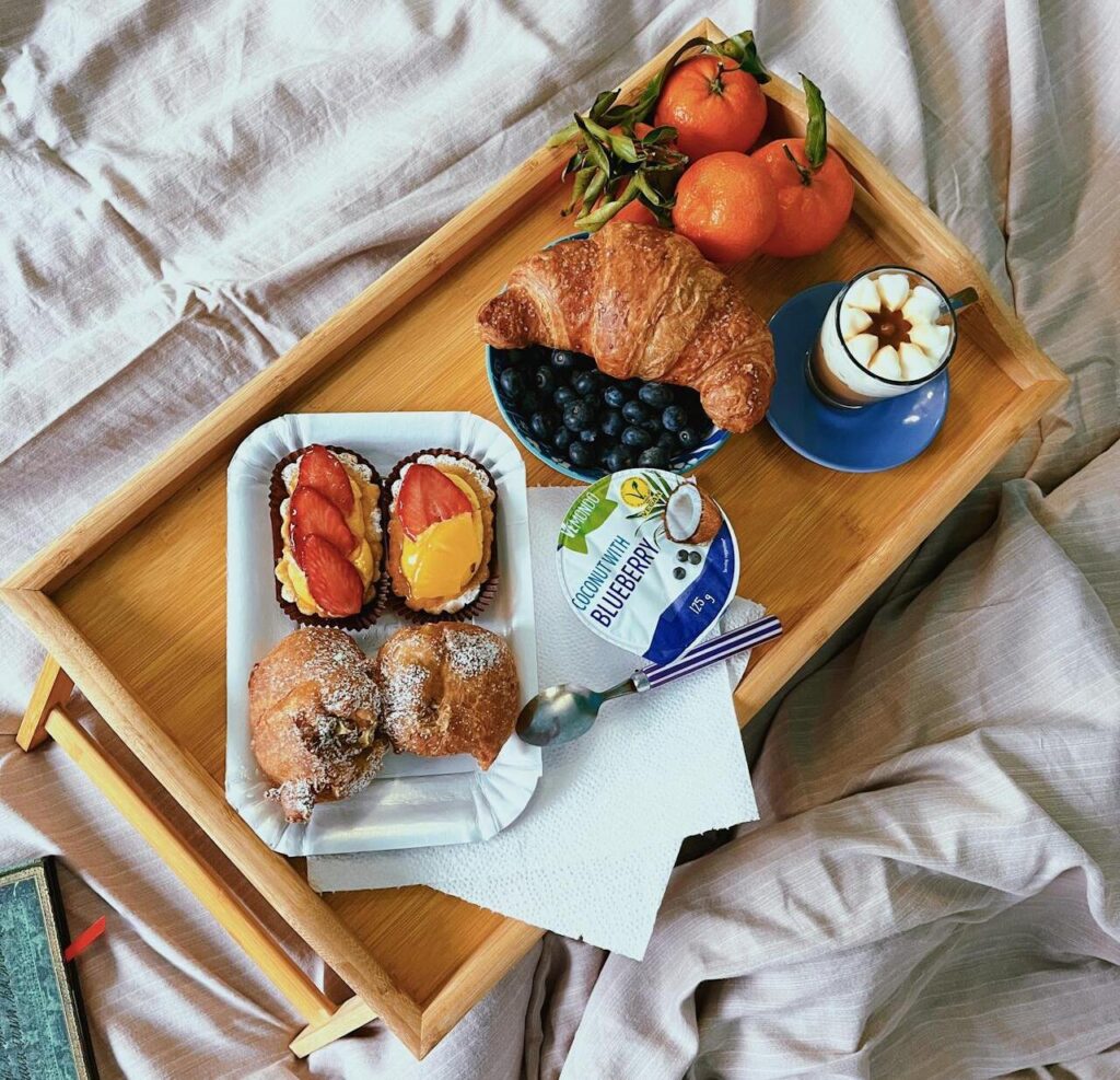 Fast food breakfast sandwiches ready on warming tray.