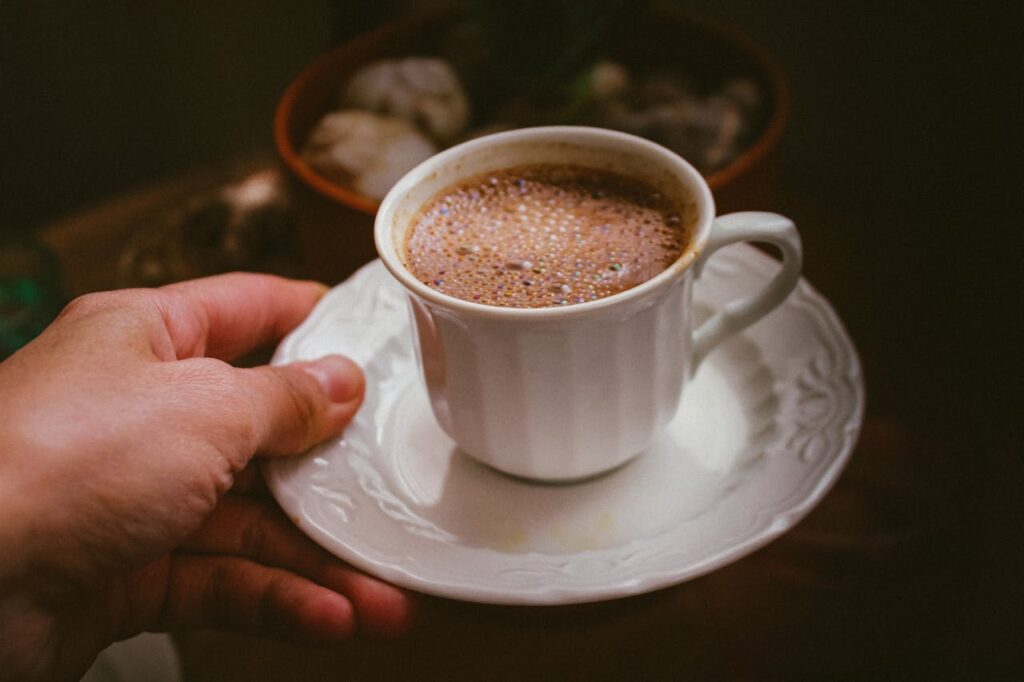 Hand Holding a Cup o Coffee