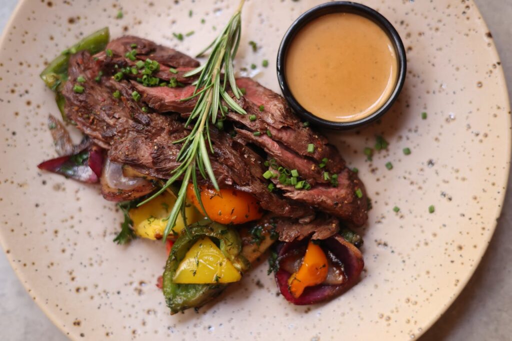 A steak with rich grill marks, highlighting beef texture.