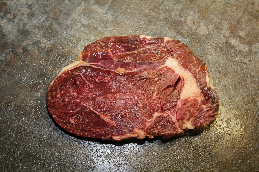 A ribeye with visible marbling and seared crust.