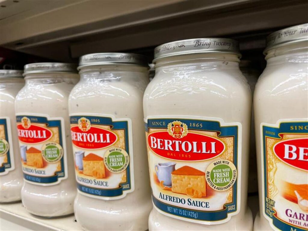 Grovetown, Ga USA - 04 30 22: Retail store spaghetti Sauce Bertolli alfredo sauce side view