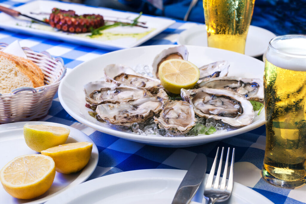 Opened oysters with ice and lemon,selective focus