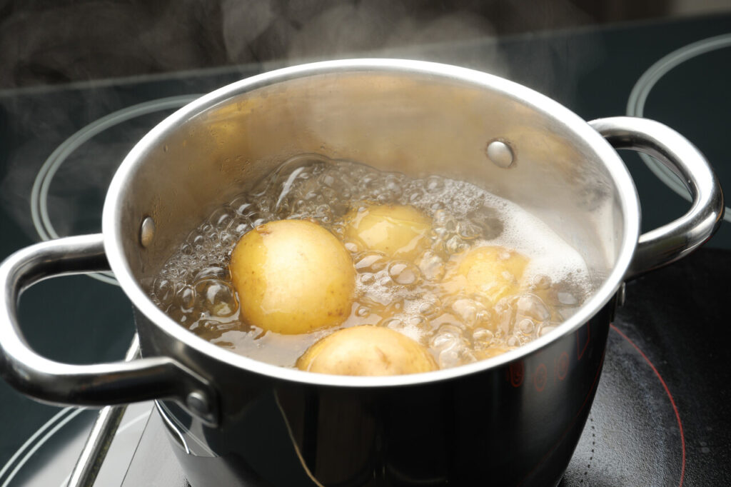 Pot of potatoes boiling on the stove
