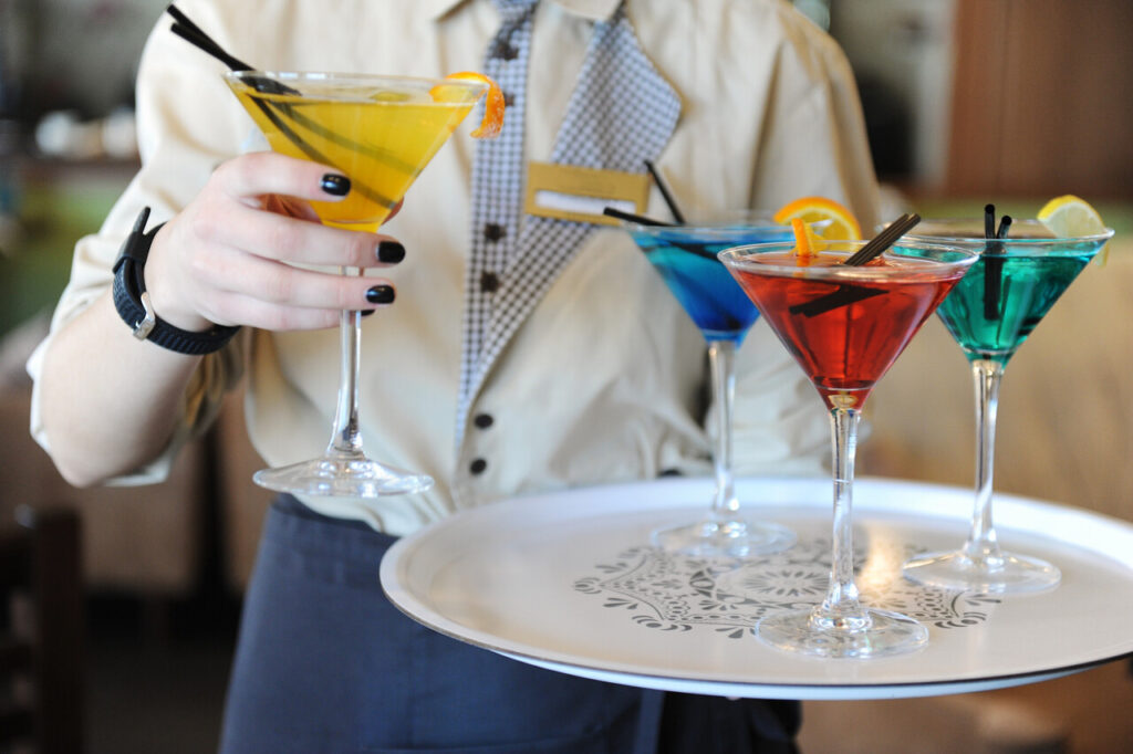 A tray of festive cocktails being served