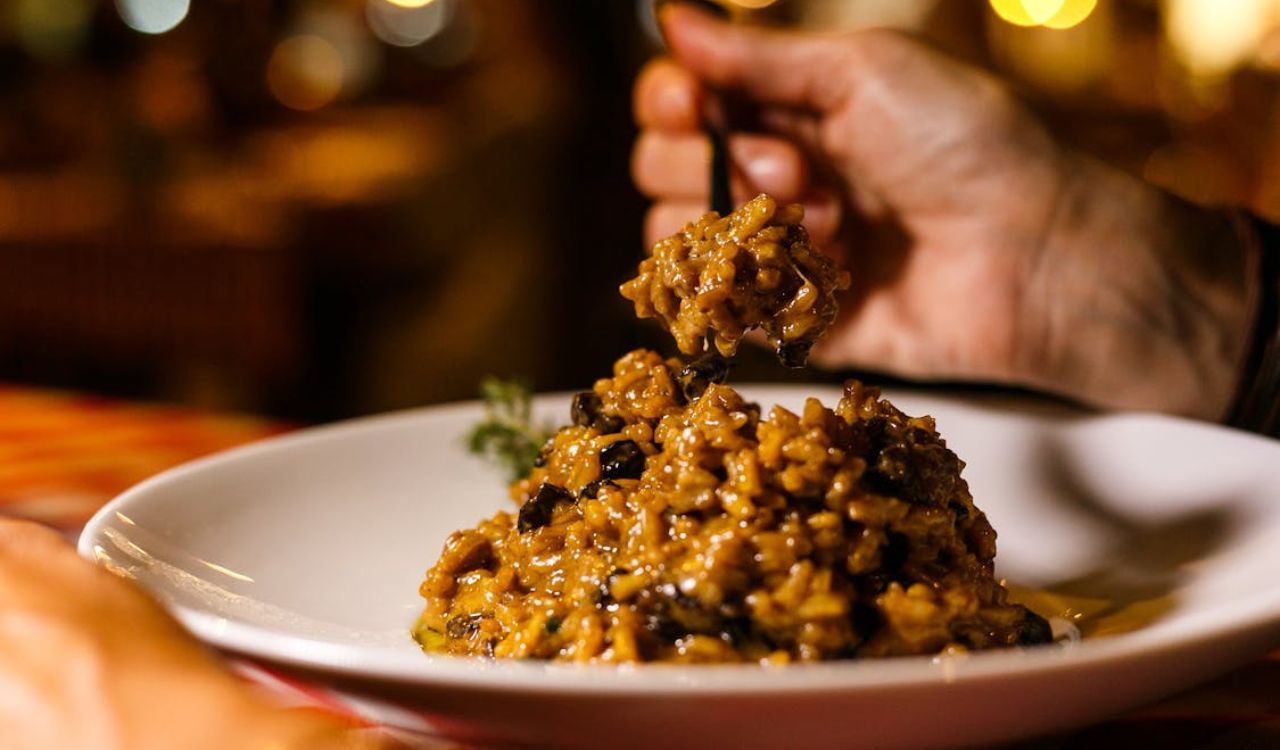 Person eating risotto