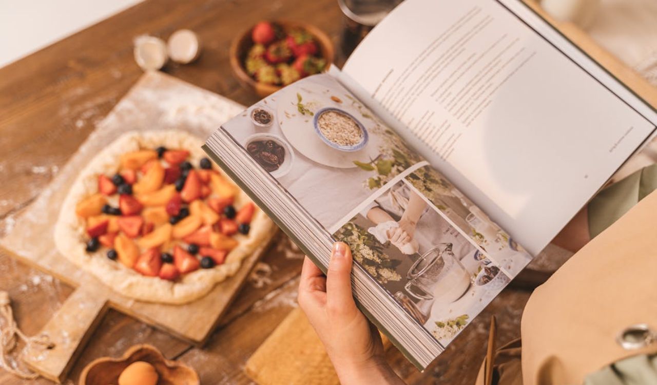 Person holding cookbook