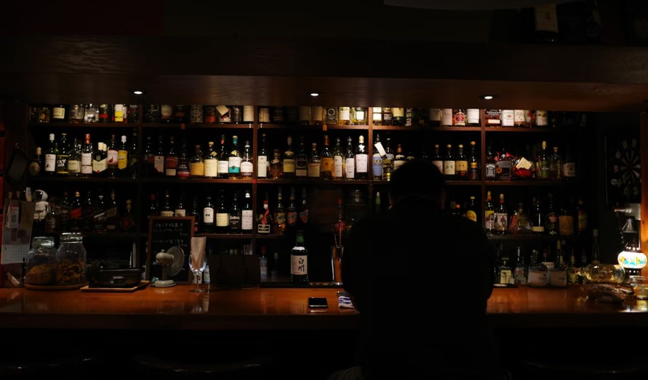 Person sitting in bar counter