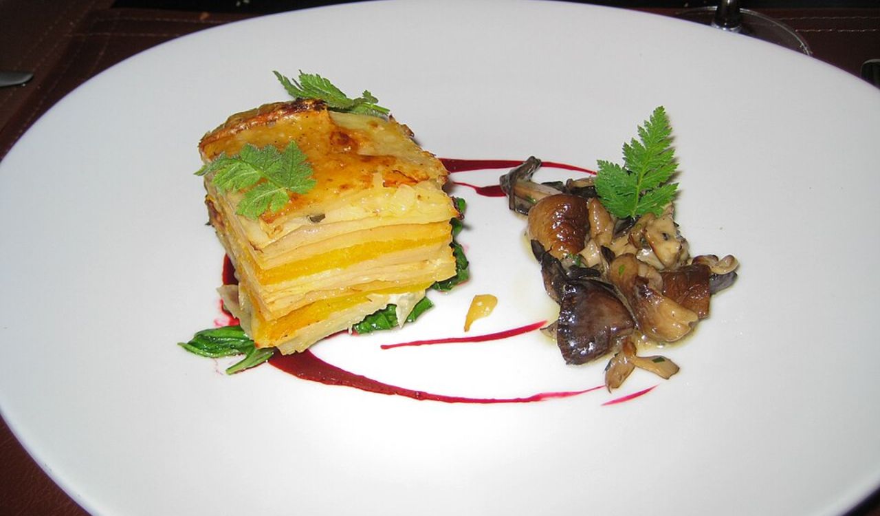 Slice of scalloped potato and wild mushroom