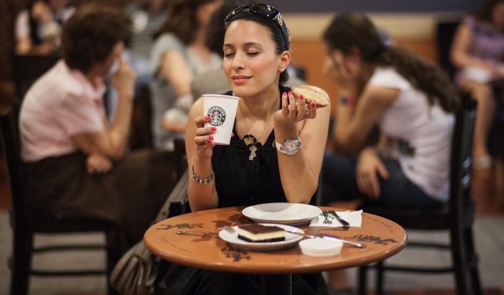 Woman enjoying Starbucks coffee
