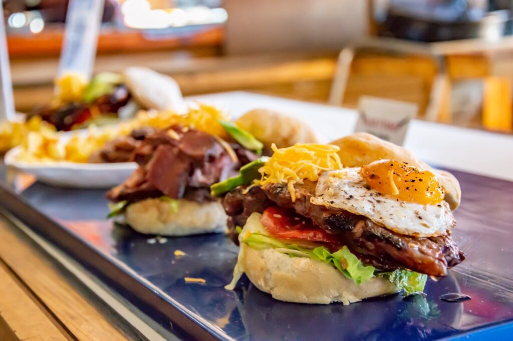 Overloaded burger spilling toppings