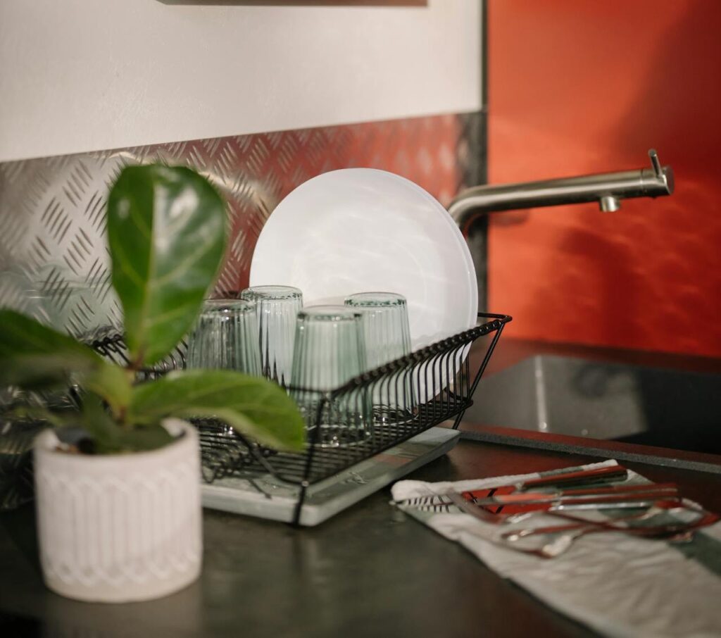 Close-up shot of clean dishes air-drying on a rack