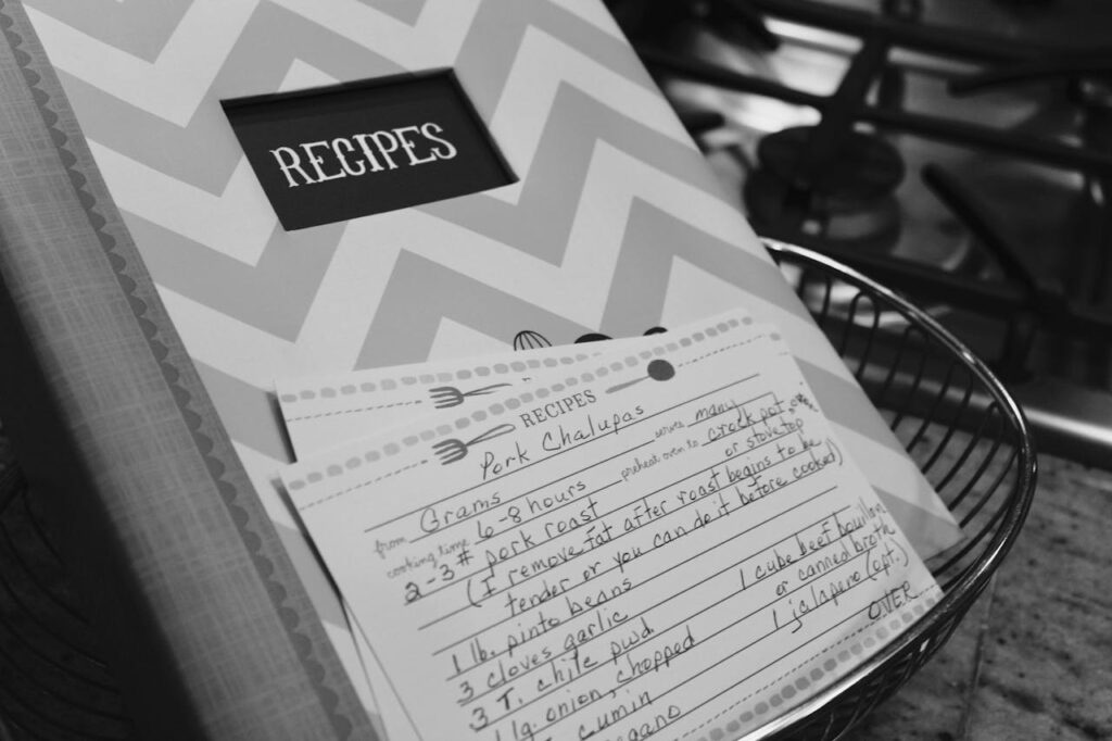 A close-up photo of an old handwritten recipe in a notebook or family scrapbook.