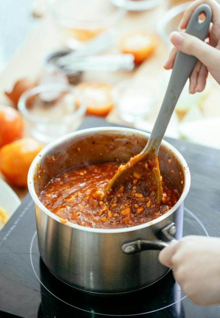 A slow-cooked pot of chili simmering on a stovetop in a homey Midwest kitchen.