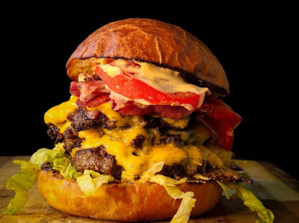 Cheese melting on a burger patty