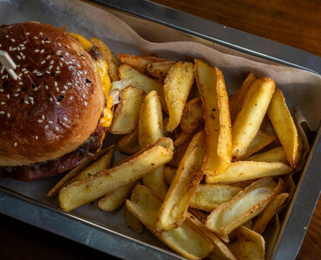 Burger with fries on a tray together