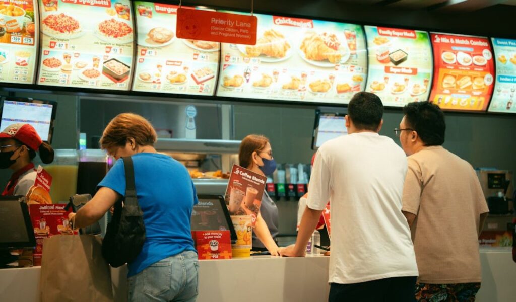People ordering in fastfood chain counter
