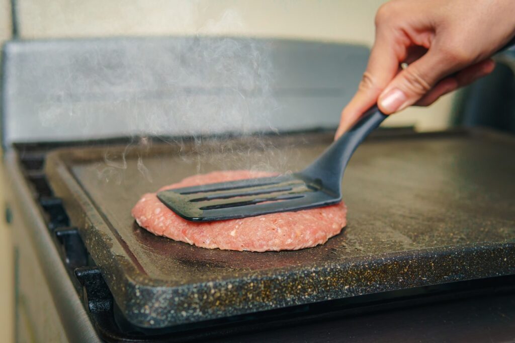 Pressing Down on Meat