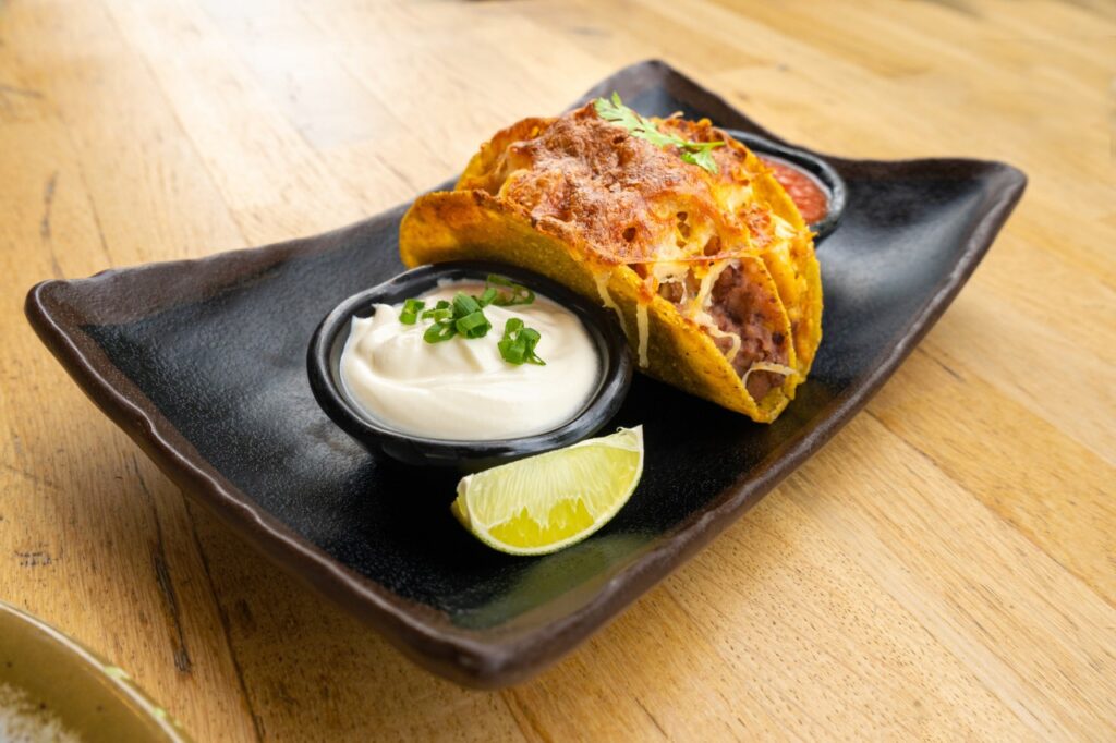 Deep-Fried Tacos Covered in Cheese Sauce